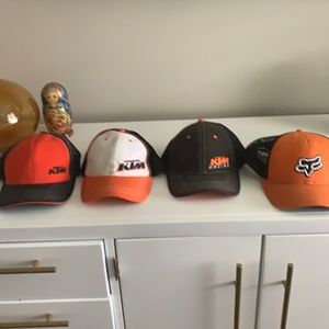 4 KTM motocross hats.